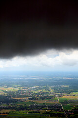 Dark, stormy clouds over Poland. View from the plane, polish landscape and dark clouds