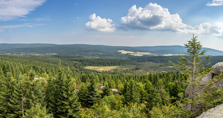 Panorama of summer mountain landscape from high stony viewpoint