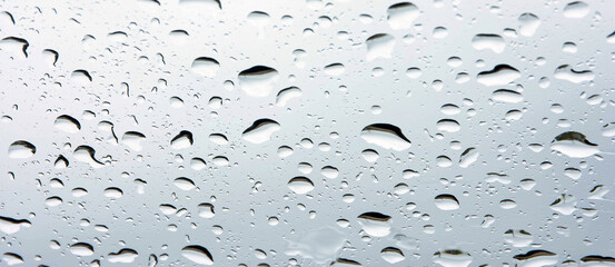 rain drops on glass.background for rainy season.