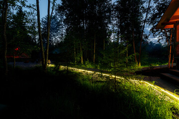 Night lights at the glamping in the forest