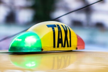 Taxi sign on a yellow cab in Bucharest, Romania
