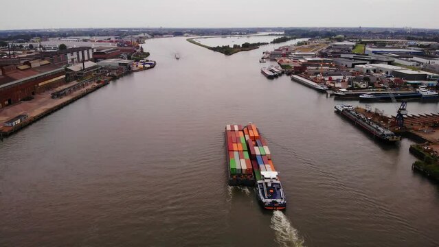 Bird's Eye View Of Two Freight Barge Transporting Intermodal Container By The Oude Maas River. - aerial