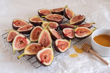 Honey covered fig fruits on drying rack. Ingredients for cooking.