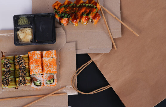 sushi in boxes and soy sauce. food delivery. High quality photo