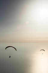 Paragliders over the sea