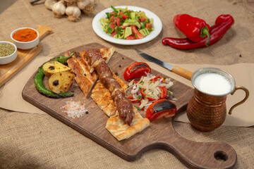 Turkish and Arabian Traditional Adana and Urfa kebab, minced meat kebab. Turkish food culture with salad on rustic wood textured background. Copy Space. stock photo
Kebab, Adana, Wrap Sandwich, Turkis