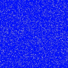Obraz premium White speckled paper on a blue surface.