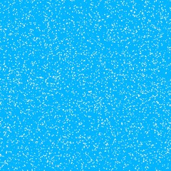 White speckled paper on a blue surface.