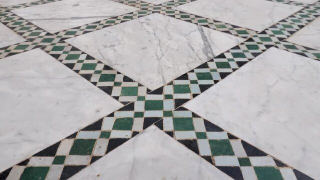 Traditional Moroccan floor with zellige mosaic tiles and marble. Pattern in Islamic geometric design. Marrakech, Morocco. 4k footage. 