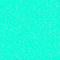 Obraz premium White speckled paper on a cyan surface