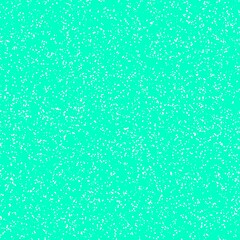 White speckled paper on a cyan surface