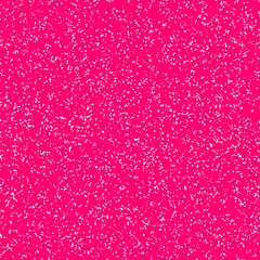 White speckled paper on a pink surface