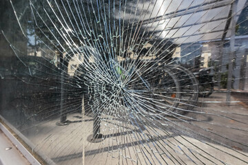 old broken glass in the window, a crack went all over the glass, texture