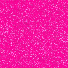 White speckled paper on a pink surface