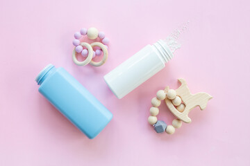 Baby care cosmetic - talcum powder in container with kids toys
