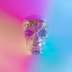 Skull with vibrant neon purple, blue and yellow color lights. Minimal Halloween retro futuristic...