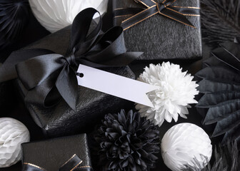Gift Boxes with Black and white paper flowers and decorations, horizontal gift tag Mockup