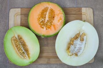 three halved melons