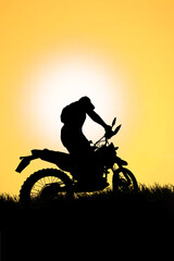 motocross driver silhouette in the evening