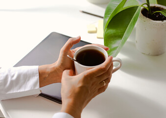 working place with cup of coffee and tablet