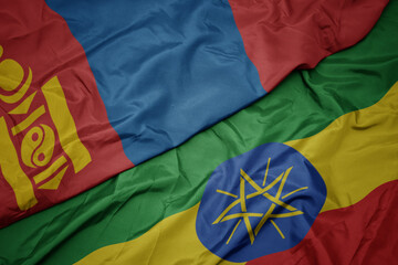 waving colorful flag of ethiopia and national flag of mongolia.