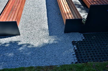 installation of a plastic mat as a substitute for lawn. plastic permeable tiles are filled with a...