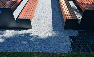 installation of a plastic mat as a substitute for lawn. plastic permeable tiles are filled with a...