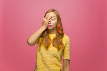 Facepalm gesture. Embarrassed annoyed young girl cover face by hand feel sorrow, shame for mistake...