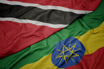 waving colorful flag of ethiopia and national flag of trinidad and tobago.