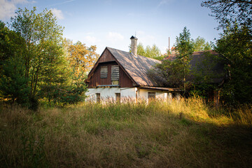 Abandoned and defunct house in the middle of forests.