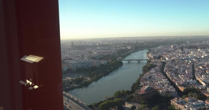 left to right slide revealing shot of sevilla from tower window aerial view