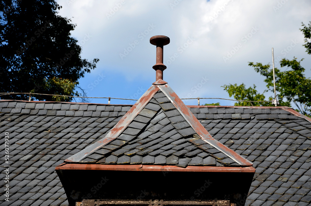 Wall mural roofs lined with natural stone slate. typical for cottages and stately residences, castles and noble