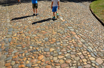 rural stone paving urban square made of quartz boulders size around 15cm joints filled with gravel...