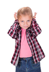 girl covers her ears. The studio shot a portrait of a thoughtful little girl who covers her ears. Copy space on white background.