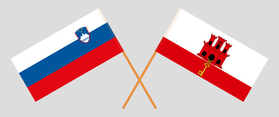 Crossed flags of Slovenia and Gibraltar. Official colors. Correct proportion