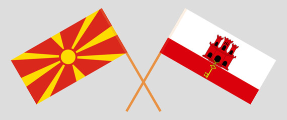 Crossed flags of North Macedonia and Gibraltar. Official colors. Correct proportion