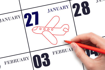 A hand drawing outline of airplane on calendar date 27 January. The date of flight on plane.