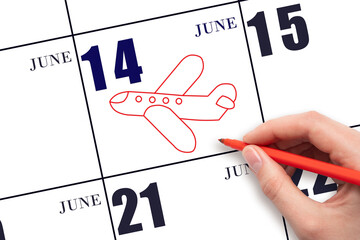 A hand drawing outline of airplane on calendar date 14 June. The date of flight on plane.