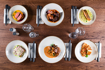 a table set in a restaurant top view of 6 dishes