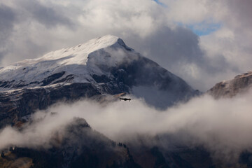 Fototapeta na wymiar Foggy Mountains, Swiss Alps Grindelwald, Switzerland
