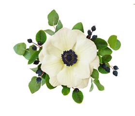 White anemone flower, black berries and green leaves in a floral arrangement isolated on white