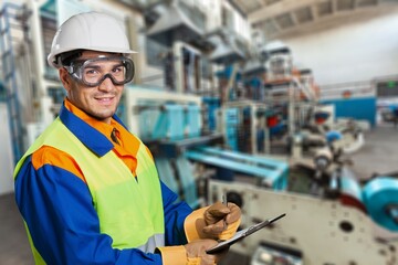 Portrait of factory worker or contractor in petrochemical industrial refinery.