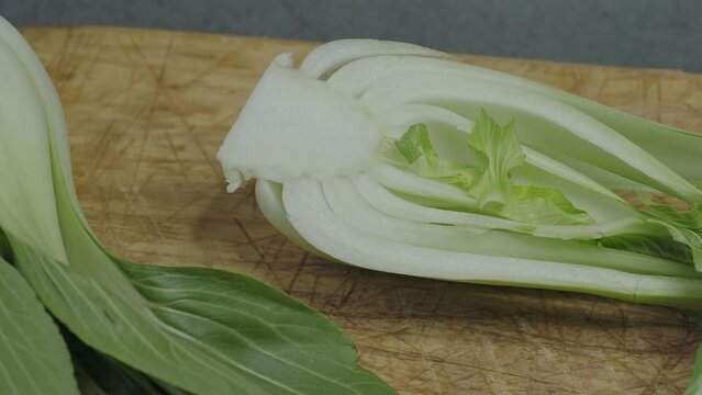 Endives on a wooden cutting board (Cichorium intybus). Fresh chicories