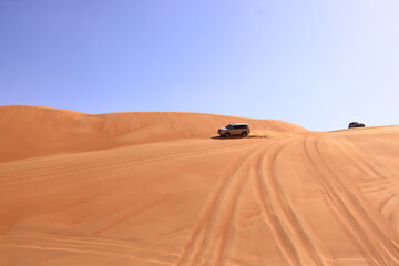 Fototapeta na wymiar SUV tour at the Wahiba Sands, Sultanate of Oman