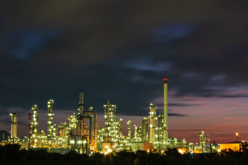 Fototapeta na wymiar Oil​ refinery​ and​ plant and tower of Petrochemistry industry in oil​ and​ gas​ ​industry with​ cloud​ blue​ ​sky the morning​