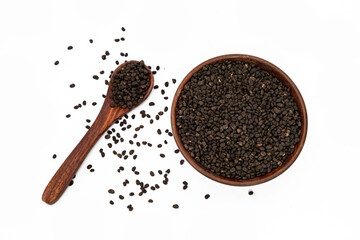 Babchi seeds or purple fleabane in wooden bowl on white background