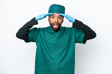 Surgeon Brazilian man in green uniform isolated on white background with surprise expression