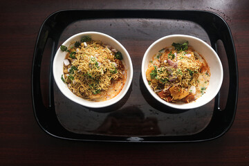 White Bowls Of Indian Vegetarian Breakfast With Potato and Spicy. Tasty Food In Holiday Time. Maharashtra Culture 