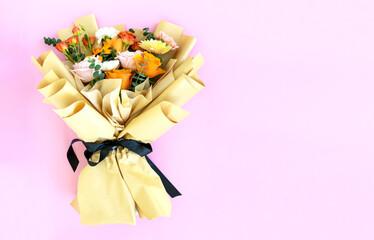 Mixed flower bouquet - Roses, gerbera daisy and carnation on pink background