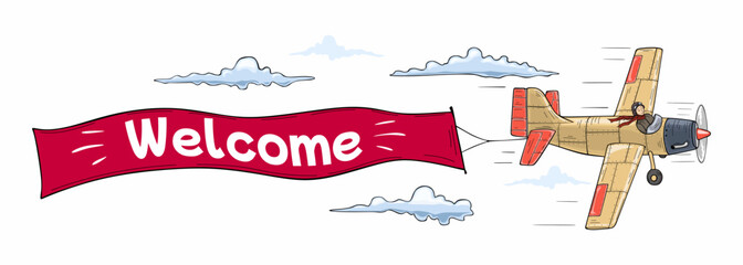 Flying advertising banner out by aircraft with the inscription Welcome © Leonid